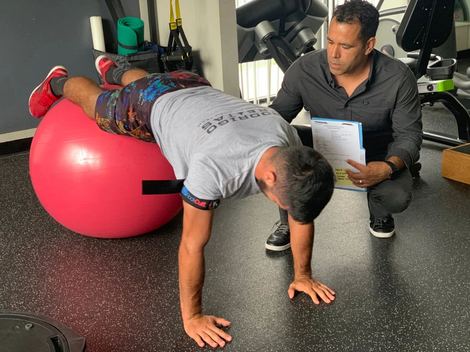 Guided therapeutic exercise with a stability ball at Advanced Balance